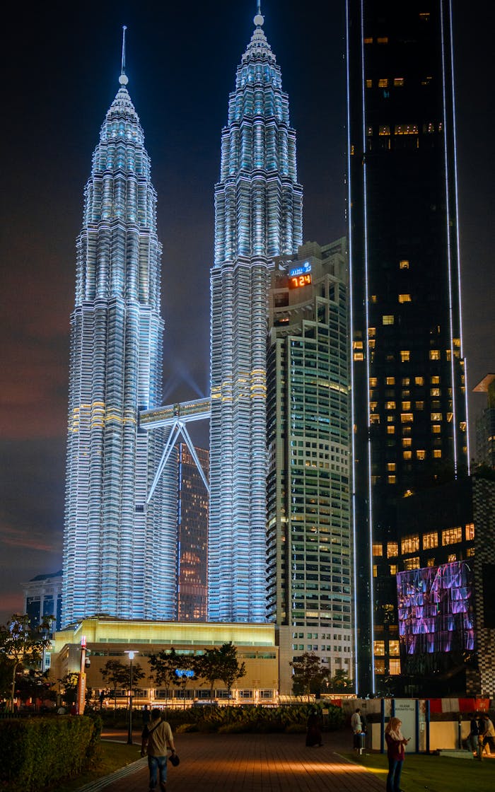 Home Night view of the iconic Petronas Twin Towers in Kuala Lumpur, beautifully illuminated.